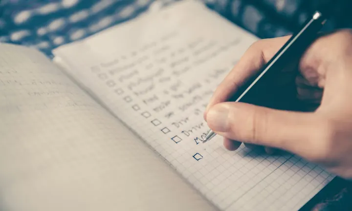 Notebook with financial goals checklist